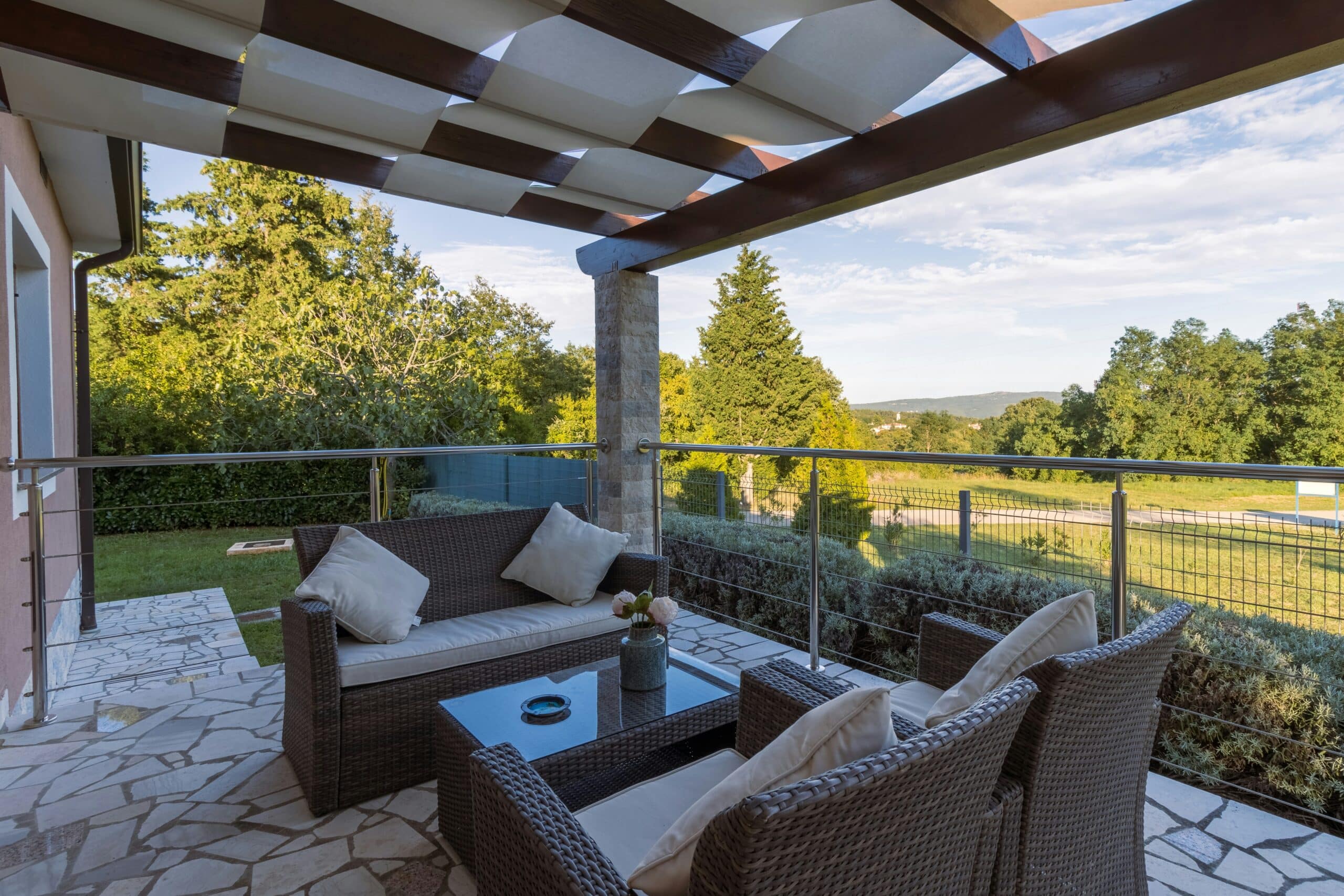 a patio with a covered patio and a table and chairs